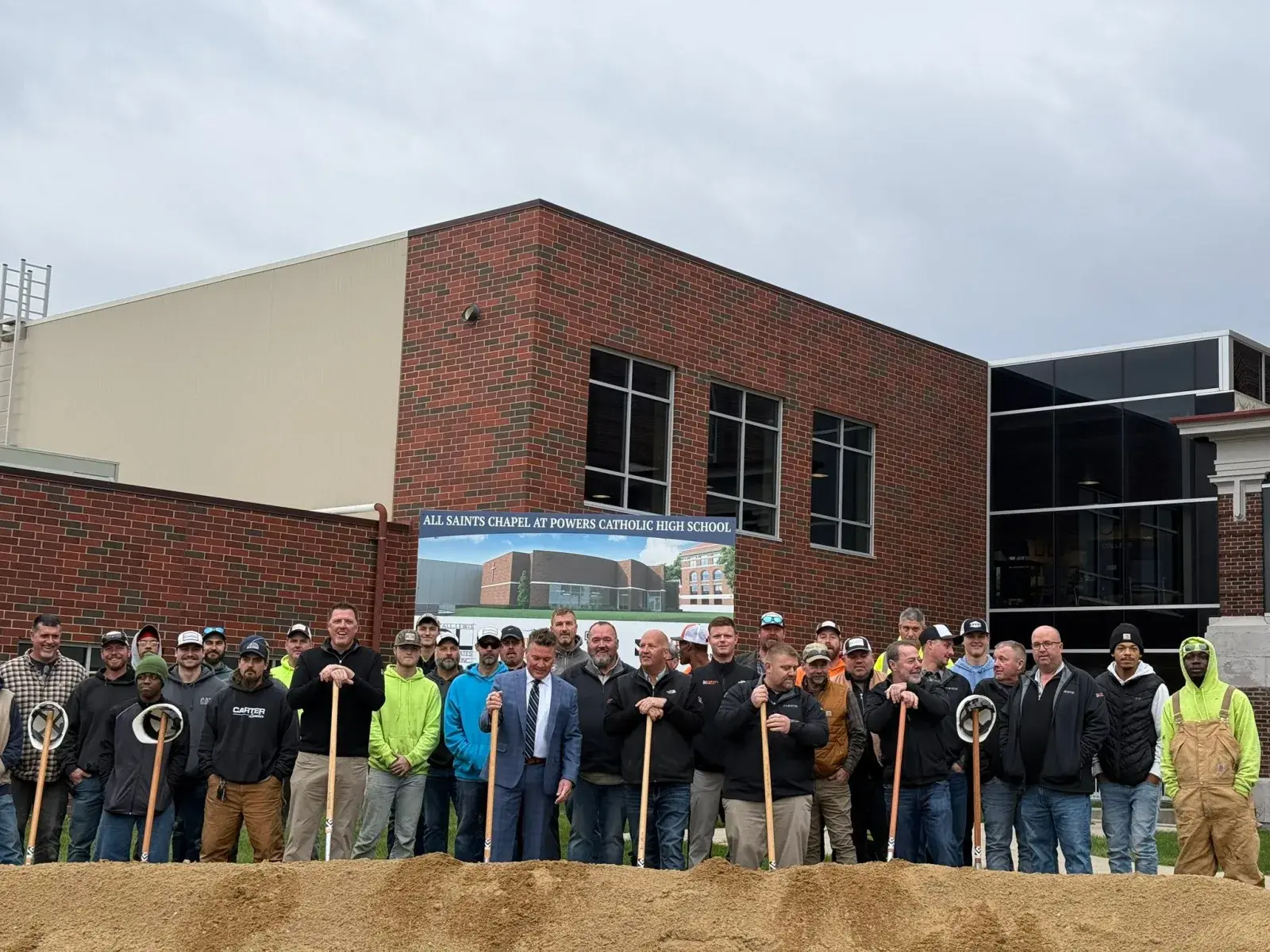The Lurvey Construction team at the All Saints Chapel groundbreaking at Powers Catholic High School in Flint, Michigan